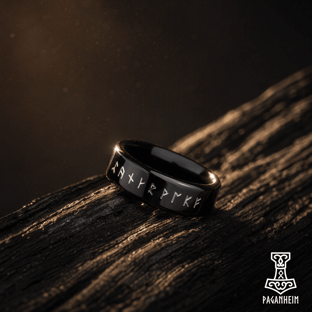 Black ring engraved with Elder Futhark runes around the band
