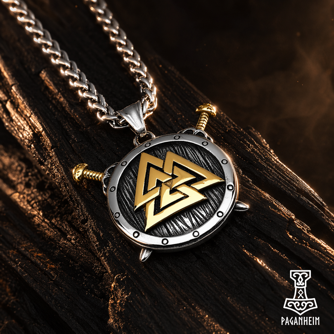 Necklace with a gold and silver Valknut pendant on a wooden background