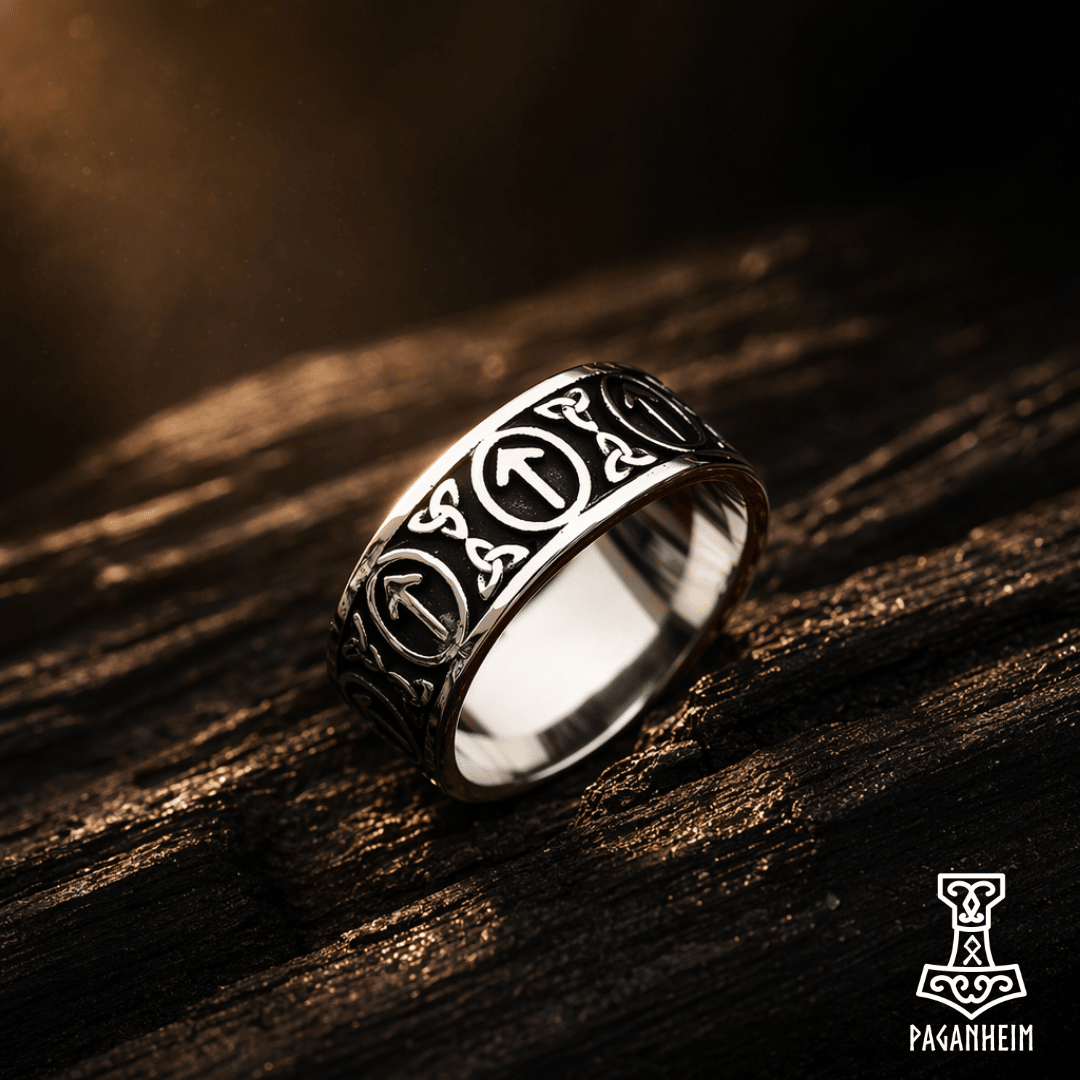 Stainless steel ring with Tiwaz rune pattern around the band