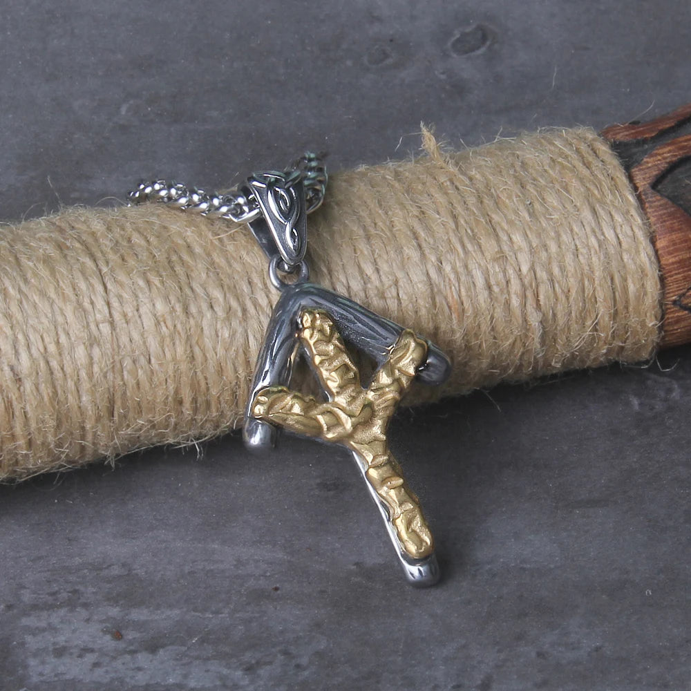 Bindrune necklace with a gold Algiz rune and silver Tiwaz rune pendant, highlighting the protective and warrior energies of Norse runes.