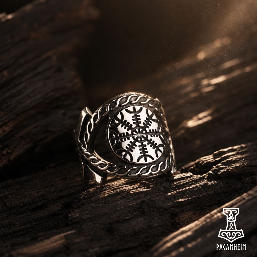 Metal ring featuring Helm of Awe symbol surrounded by Norse patterns