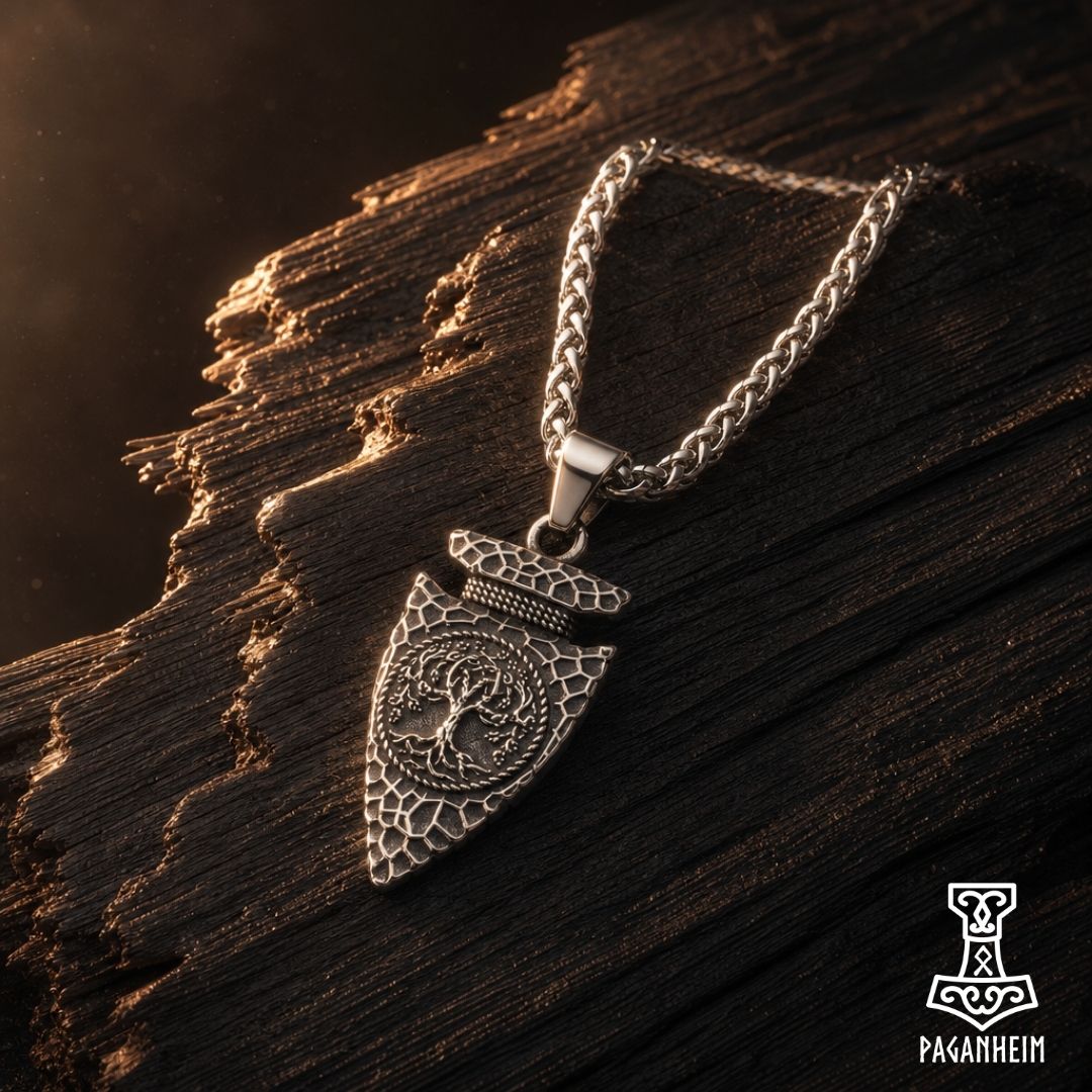 Stainless steel pendant shaped like Odin’s spearhead with Yggdrasil engraving.