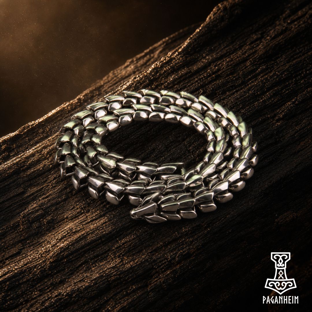 Silver necklace shaped like coiled serpent with detailed head clasp