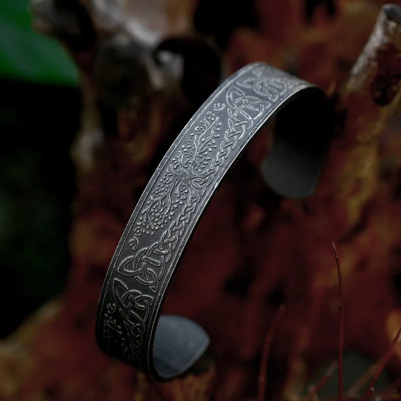 Detailed view of Yggdrasil and Celtic knots on the arm ring.