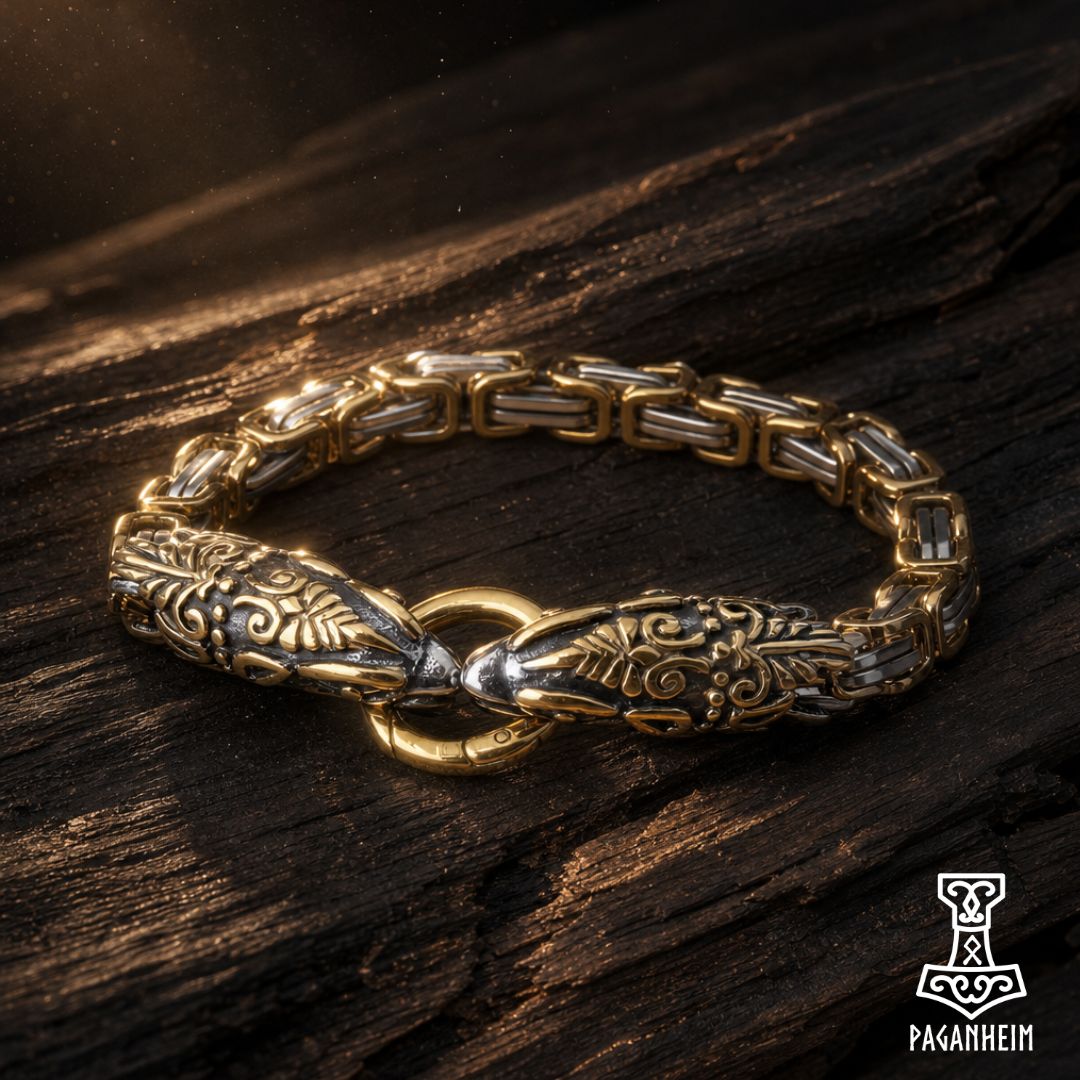 Norse serpent bracelet resting on wooden surface under warm light.