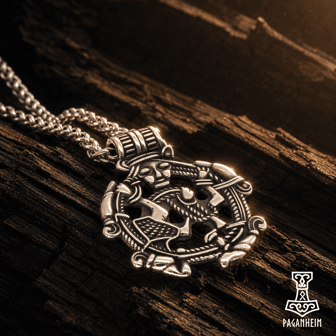 Norse‑inspired pendant featuring four animal heads and central figure