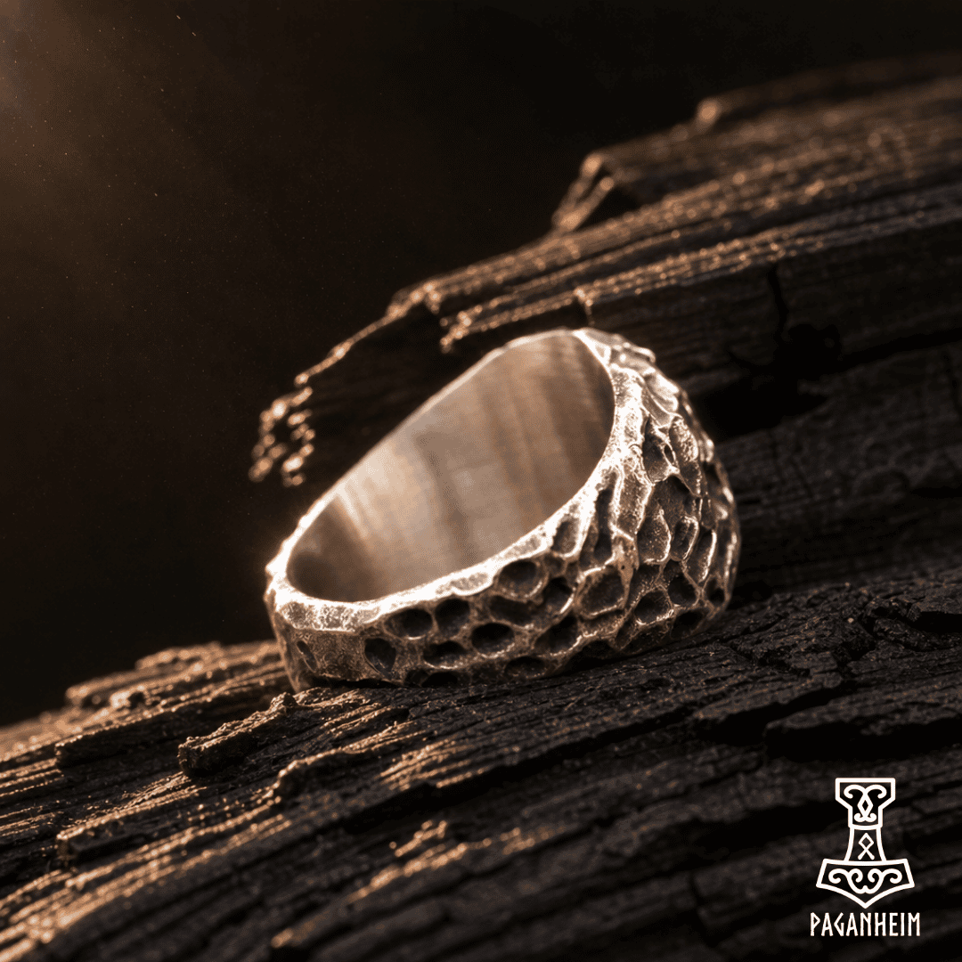 Hammered Vegvísir ring photographed under warm lighting
