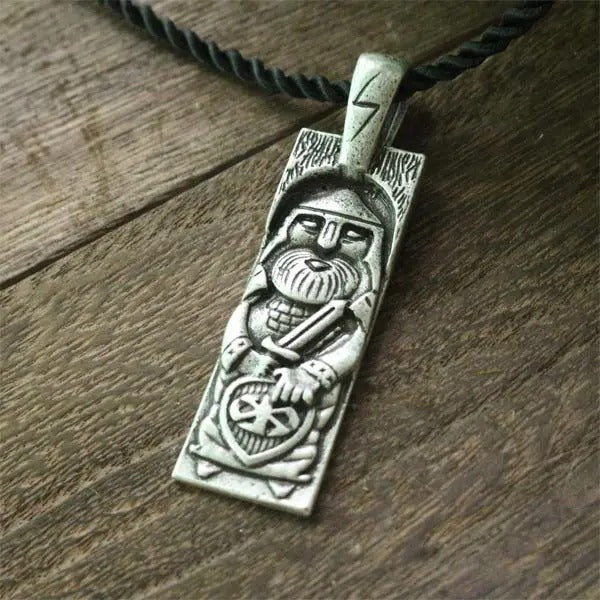Ancient-style pendant depicting Perun, Sowilo rune, and solar cross.