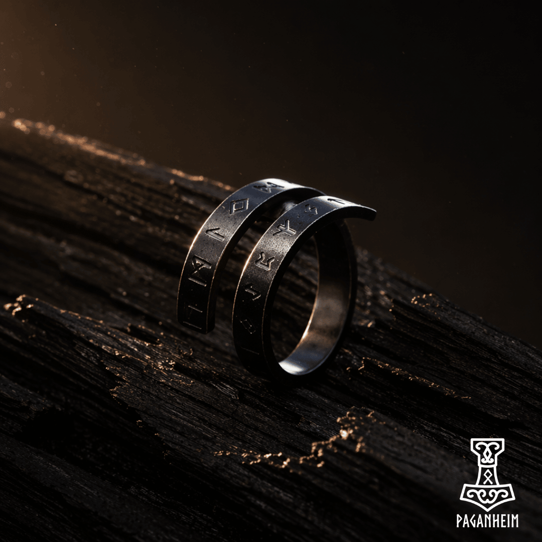 Closeup of twisting rune ring resting on dark wood