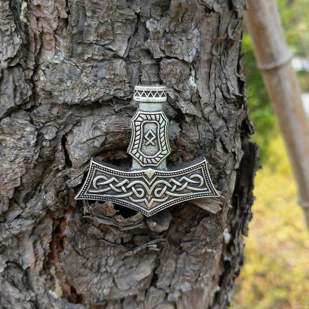 Viking Mjölnir necklace with Othala rune symbol of heritage and strength.