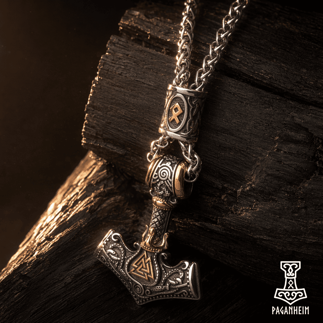 Engraved Thor's Hammer amulet photographed on textured wood