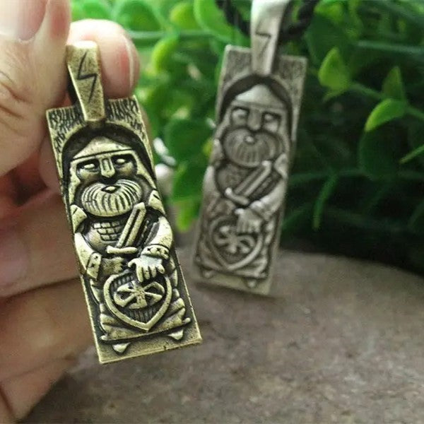 Gothic-Scythian inspired amulet showing Perun with sword and sun cross.