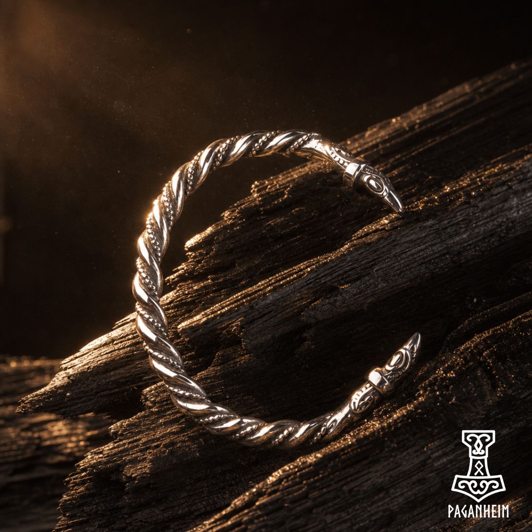 Stainless steel bracelet with raven head design and twisted pattern.