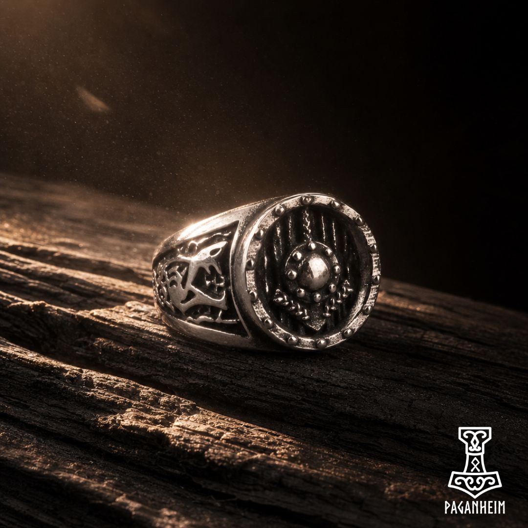 Silver ring featuring engraved Tiwaz rune on shield design