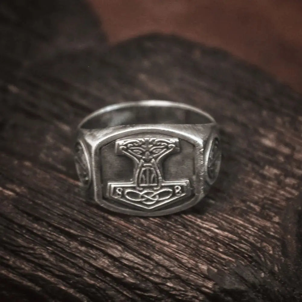 Sun Wheel and Mjǫllnir signet ring inspired by Indo-European heritage.
