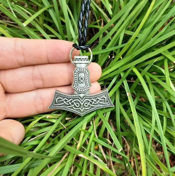 Thor’s hammer pendant in silver color with the Othala rune engraving.