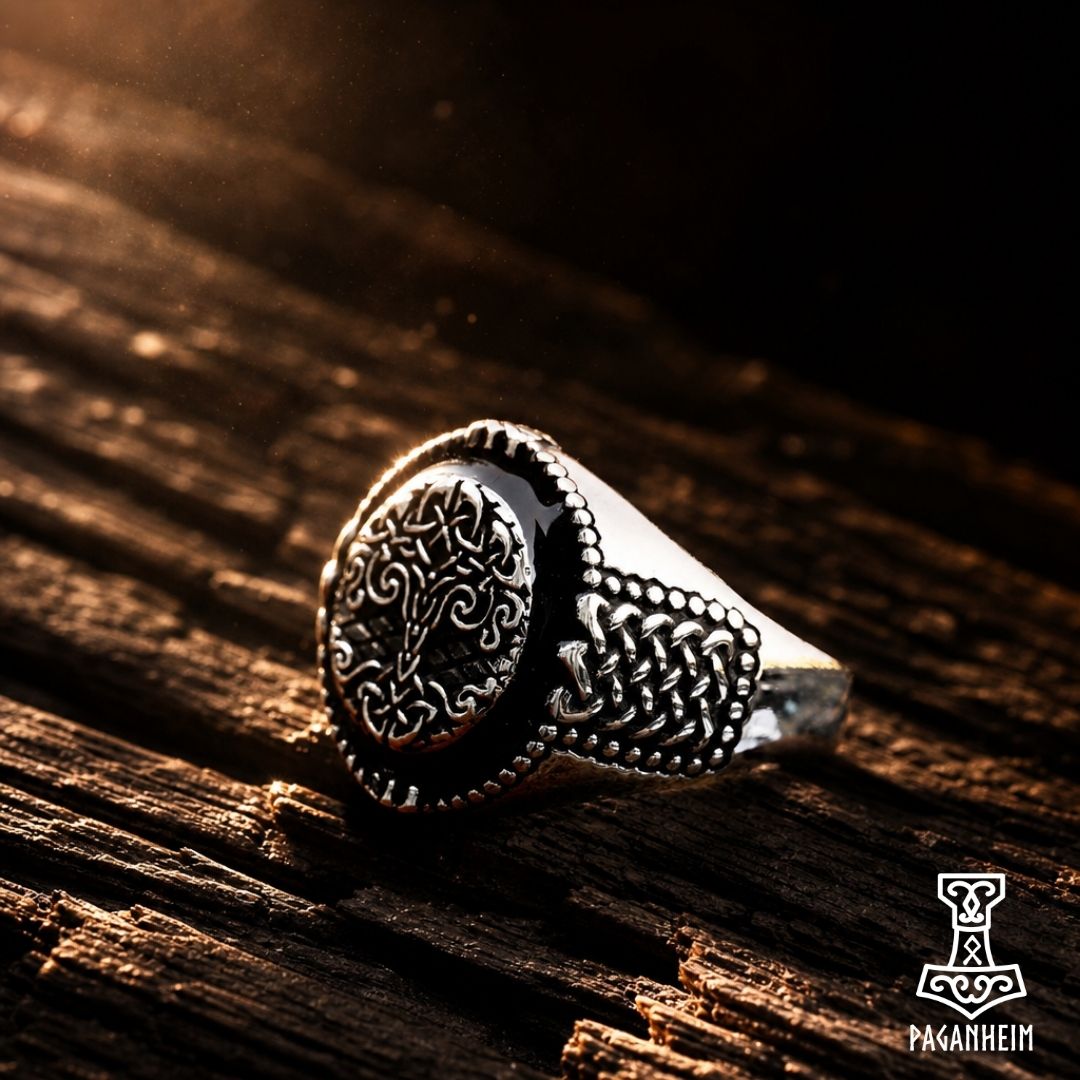 Closeup of Yggdrasil ring showing detailed crown engraving and geometric side pattern