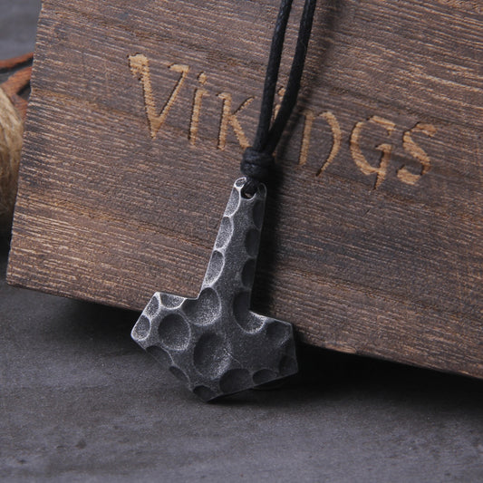 Detailed View: Ancient-Inspired Mjolnir Pendant with Rugged Charm and Chipped Details.