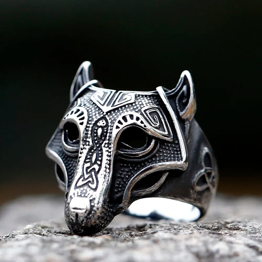 Immerse yourself in the Norse saga with Fenrir's Oath Ring, a masterpiece of Old Norse artistry. Featuring an upward-pointing eared Fenrir head, the ring is adorned with captivating engravings and a triquetra symbol on the side. Delve into the complexities of Fenrir's spirit, bound by an oath of revenge against the Aesir gods.