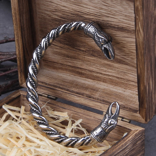Hrafnbróðir Arm Ring, a torq/bangle crafted from premium 316L stainless steel, featuring adjustable elegance and raven heads inspired by Odin's Ravens, Huginn and Muninn.