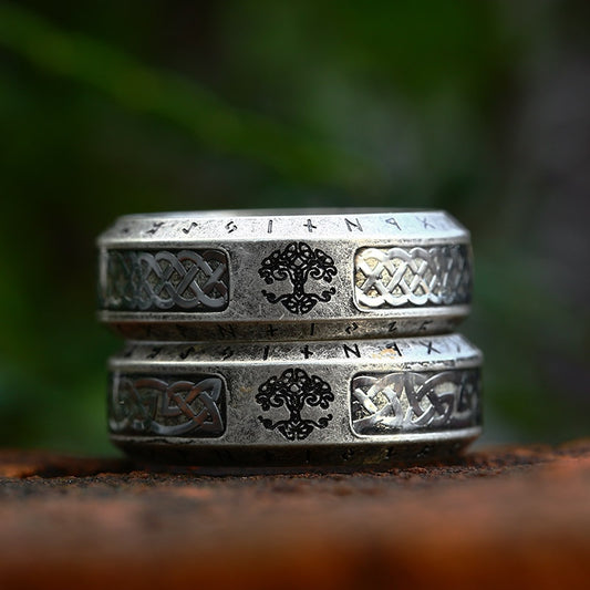 Image Displays Two Ancient Silver Rings - Rings are Engraved with the Image of Yggdrasil, the Cosmic World Tree, Flanked with Engraved Celtic Knot Artistry with Elder Futhark Runes Etched all Across the Rings' Edges | Front Image 2