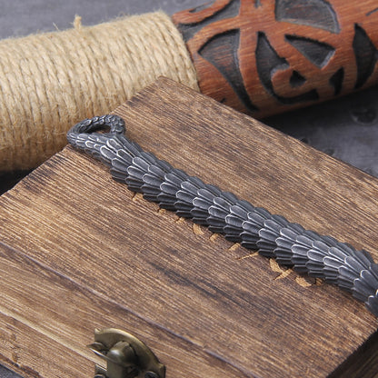 Detailed shot of Jormungandr Bracelet's oroborous clasp, symbolizing the serpent's biting head and tail.
