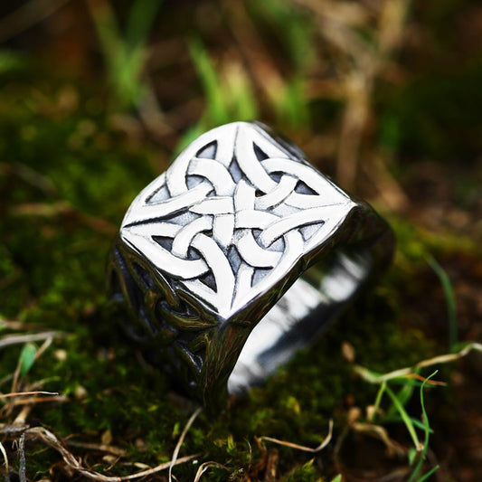 Front view of a Celtic Knot Weave Ring, a piece of Old Norse and Scandinavian Pagan Jewelry. The stainless steel ring is bulky and features intricate Celtic Knot artistry across its outer part