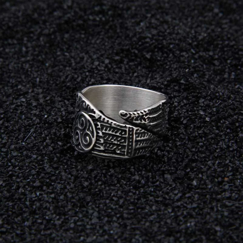 Norse spiral ring featuring Odin's ravens, Hugin and Munin, with Triquetra engravings.