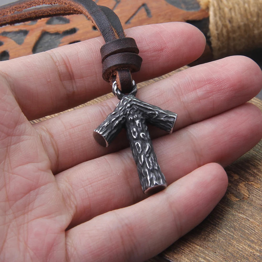 Close-up of a Tiwaz rune pendant on adjustable leather.