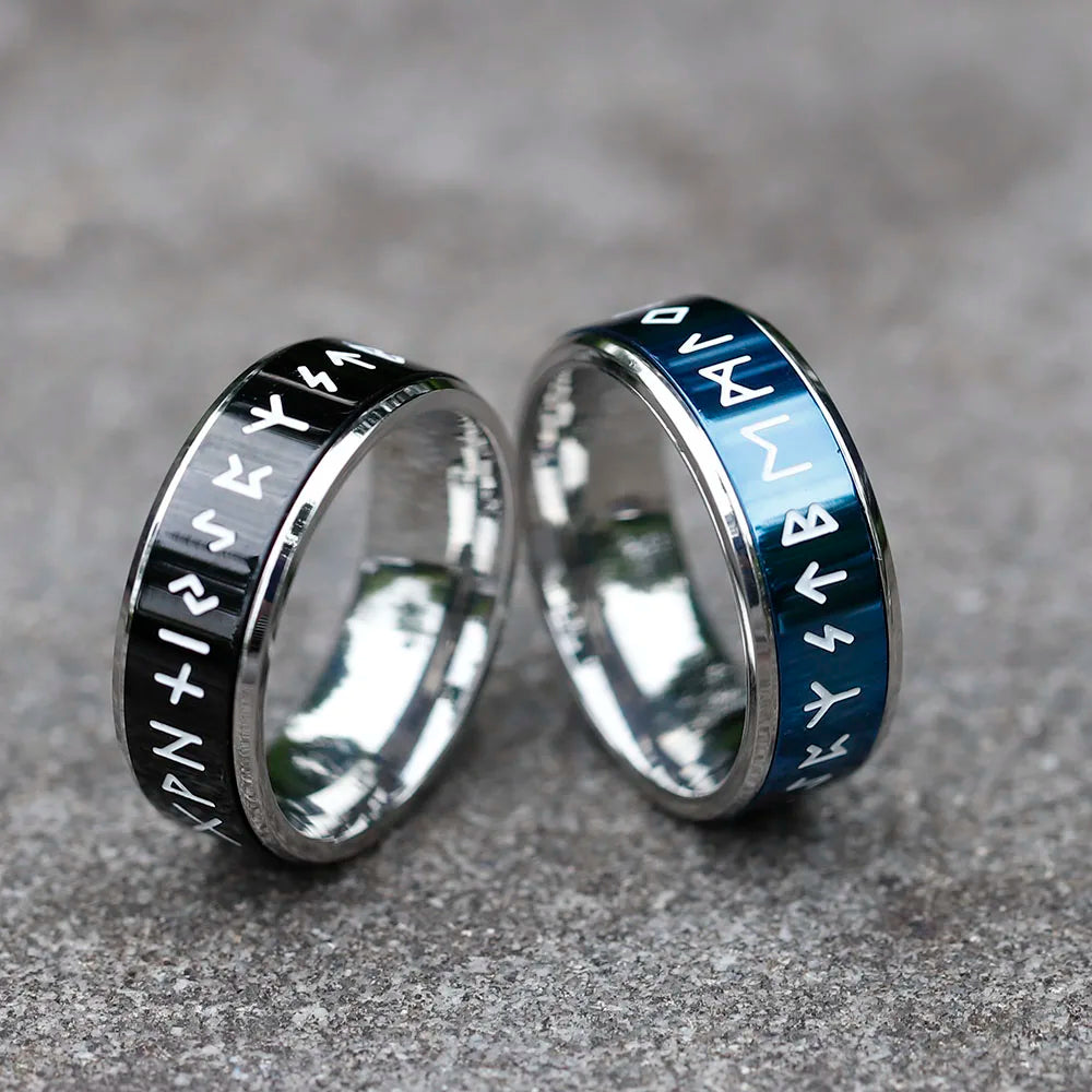 Adjustable ring collection showcasing Elder Futhark runes in silver, black, and blue.