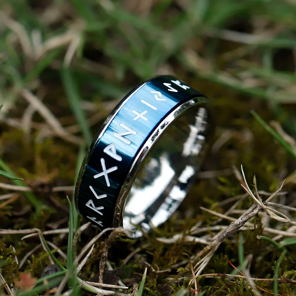 Black ring featuring Elder Futhark rune etchings with a rotatable design.