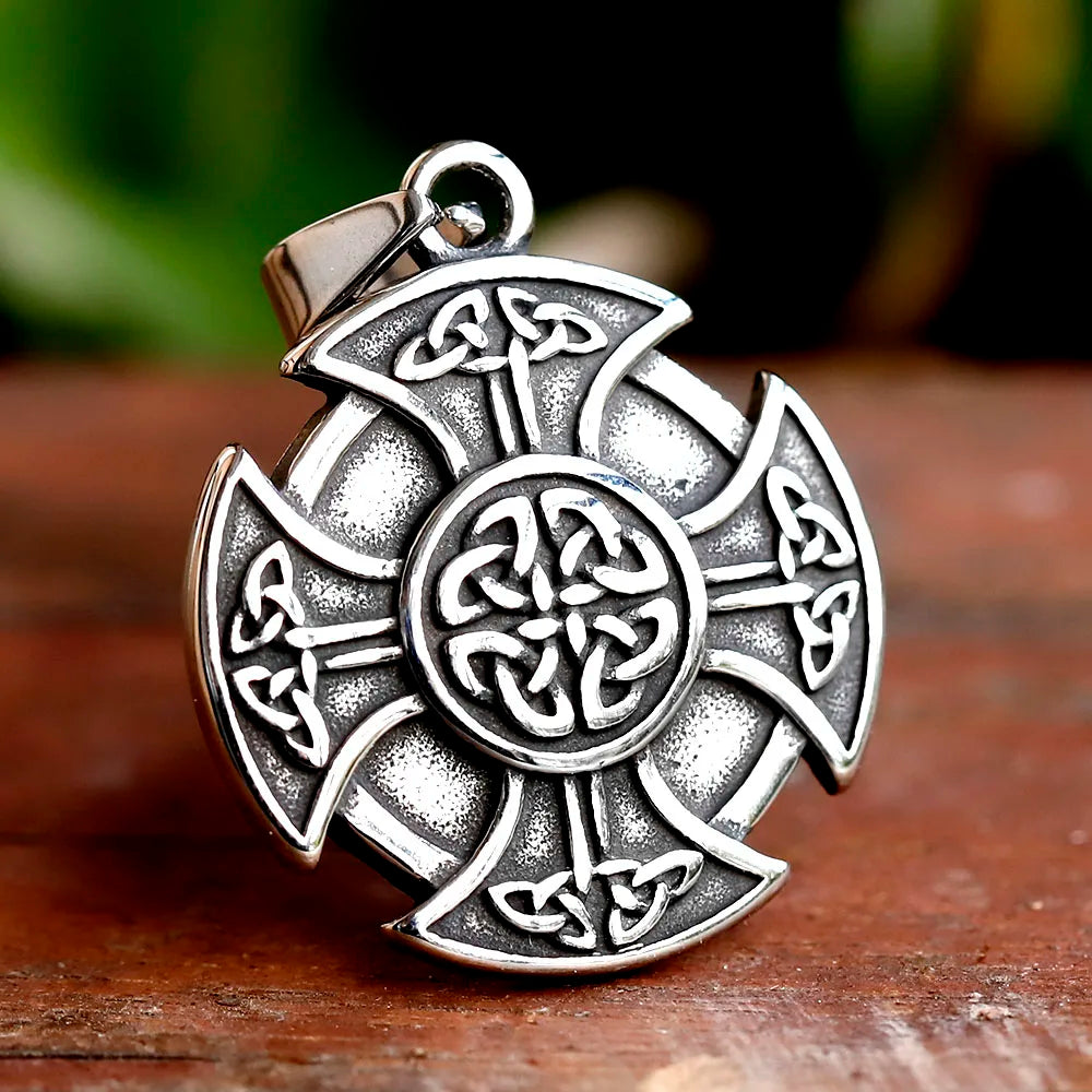 Celtic cross pendant amulet with intricate knotwork details.