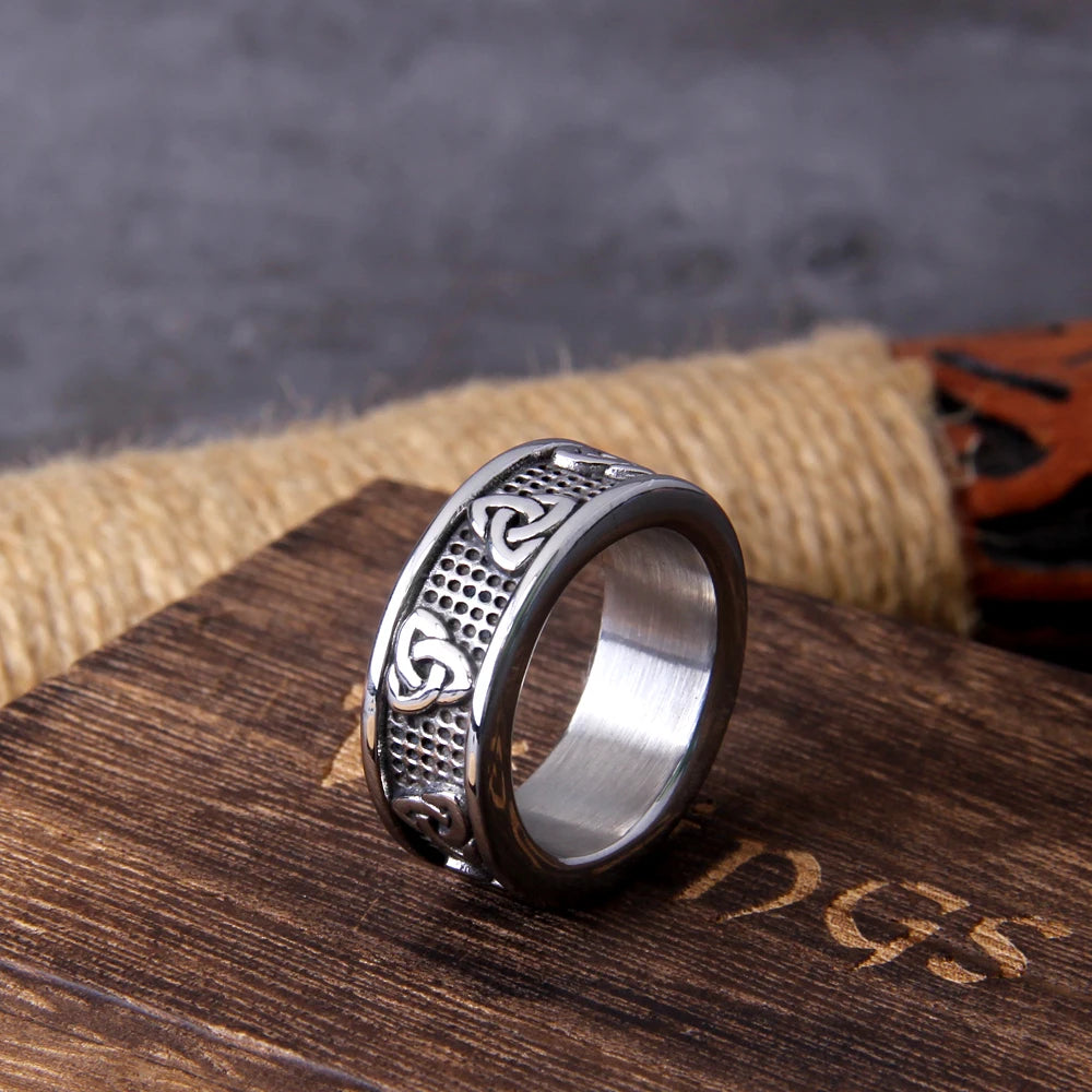 Close-up image of a Celtic Triquetra ring, featuring the ancient Triquetra knot symbols engraved on high-quality stainless steel.