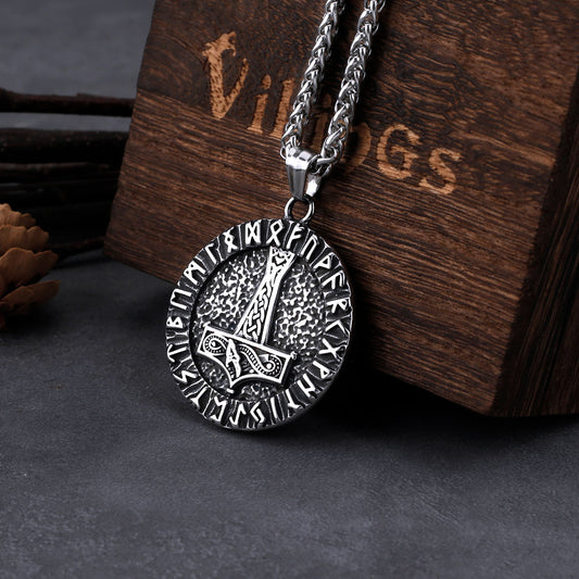 Circular Norse pendant with prominent Mjolnir symbol, a nod to Old Norse strength and protection.