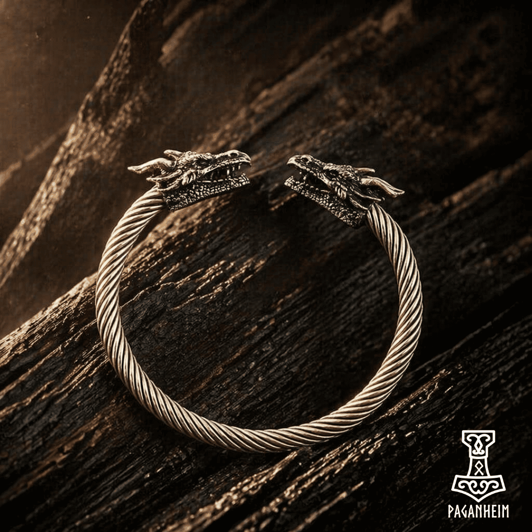 Germanic dragon-headed arm ring, wood background with warm lighting