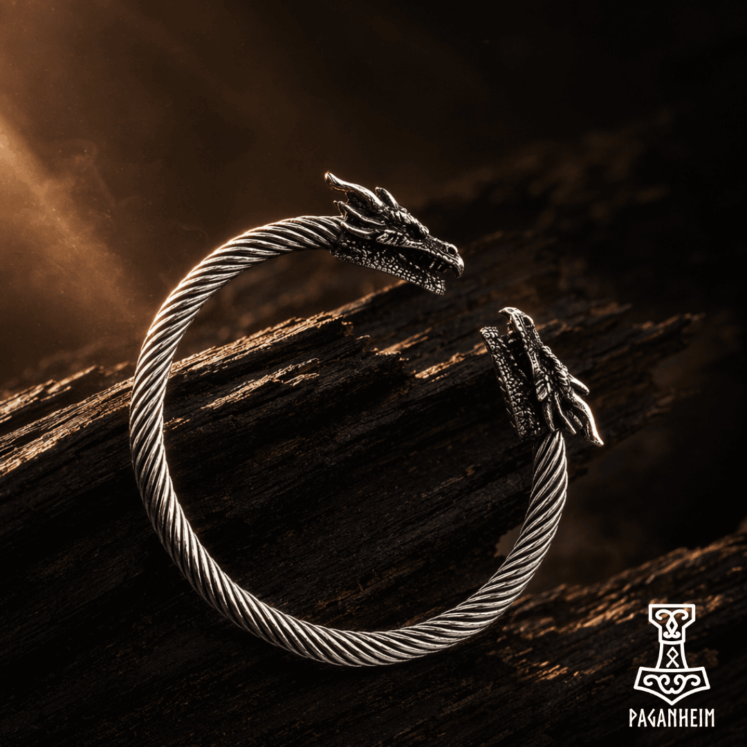 Dragon headed nordic arm ring, wooden background