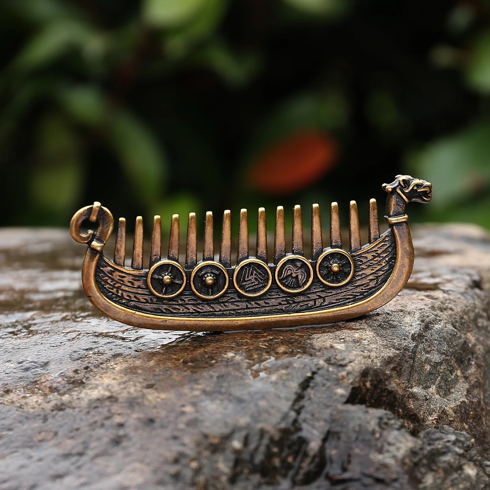 Close-up of dragon head prowl on Viking ship-shaped hair comb