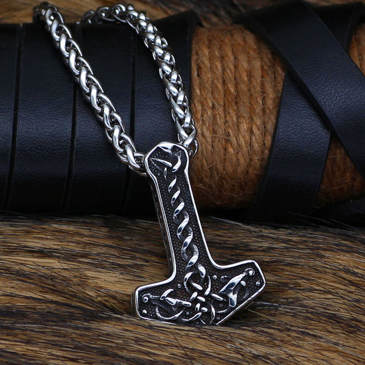 Nordic Celtic-inspired Mjolnir pendant in shiny silver and black hues.