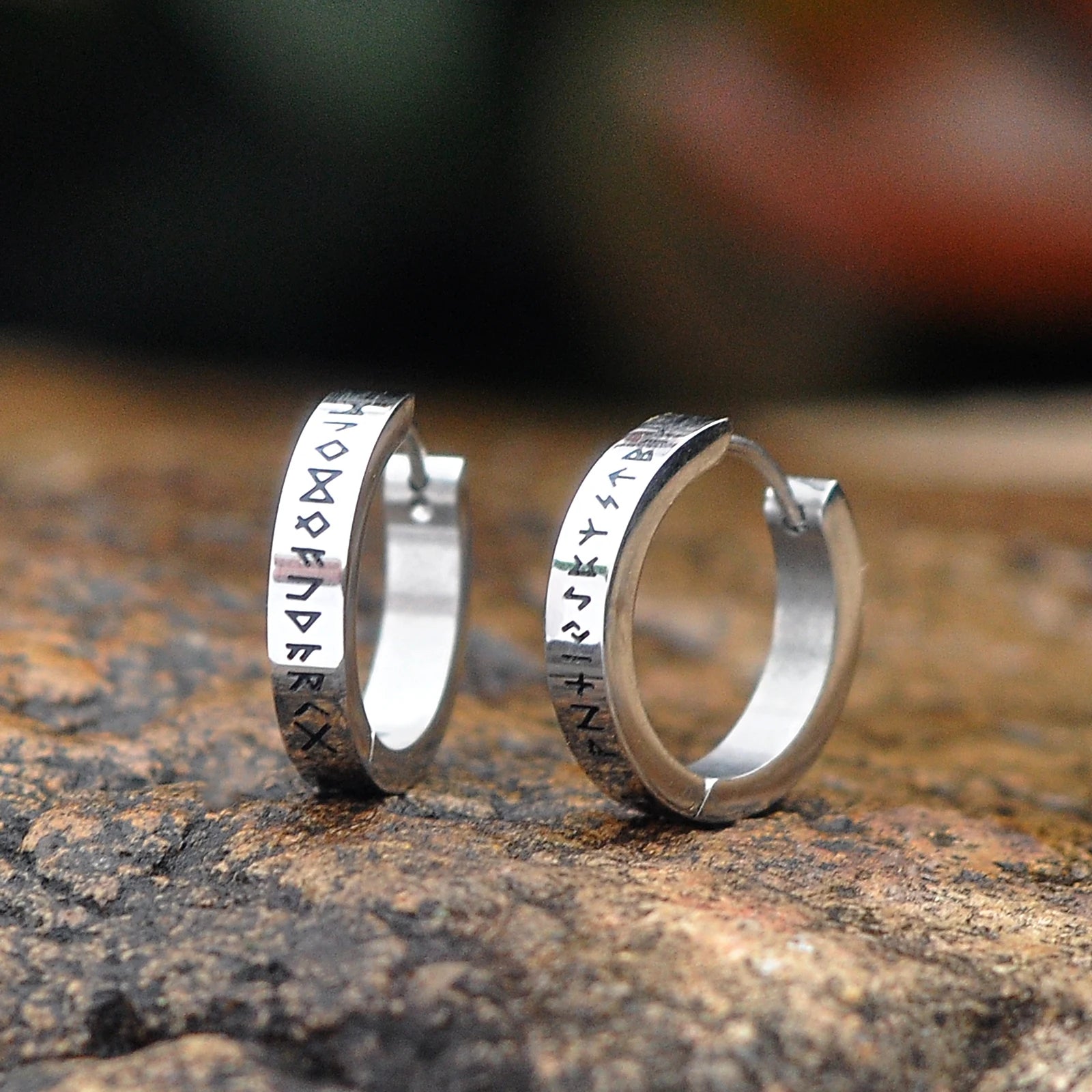 Silver Elder Futhark rune earrings displaying Viking runes.