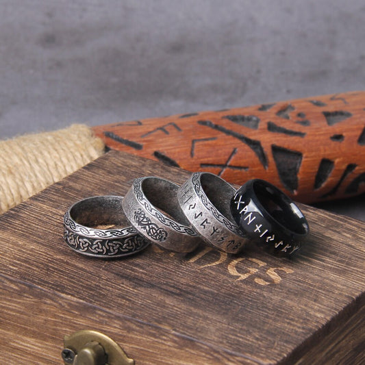 Norse Rune Ring Set, a diverse collection including black and silver variants with runic and Celtic engravings.