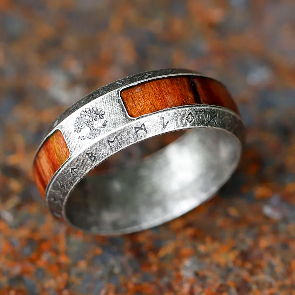 Close-up of timber design on Norse-inspired steel ring