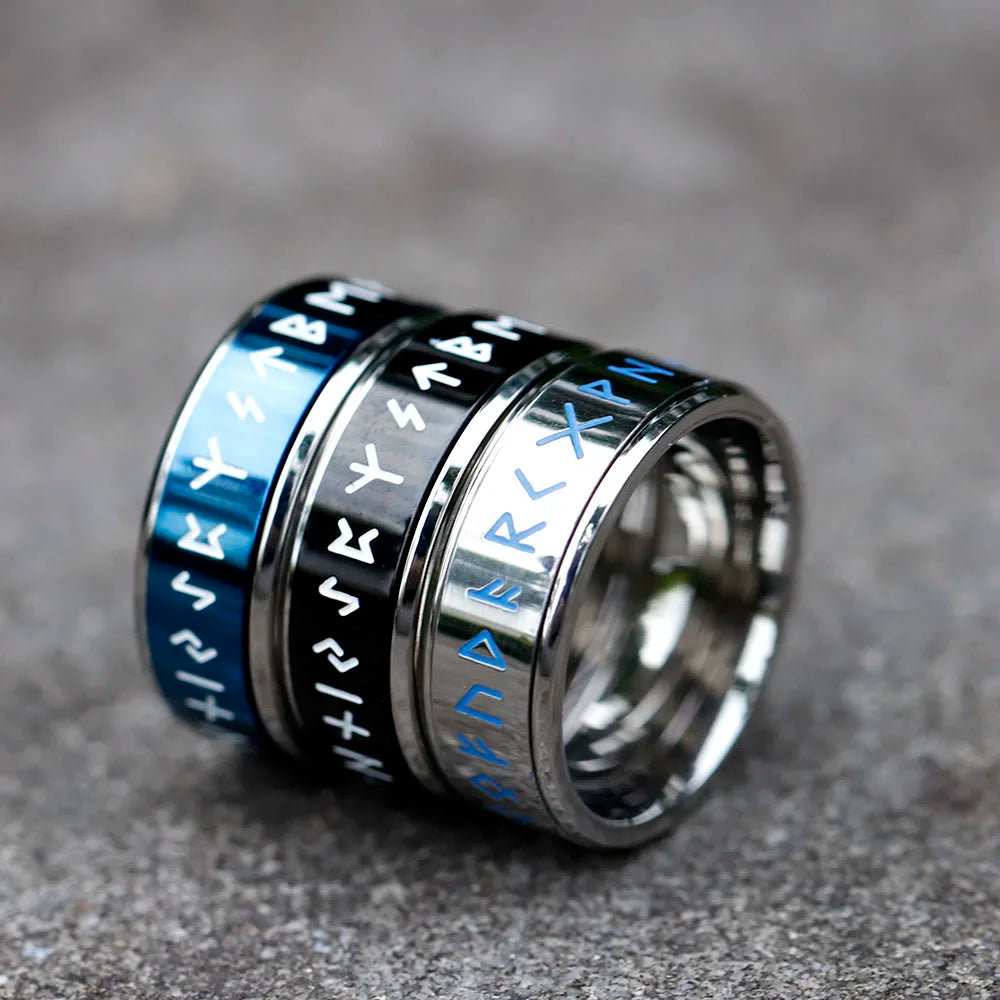 Silver ring etched with Elder Futhark runes and rotatable band.