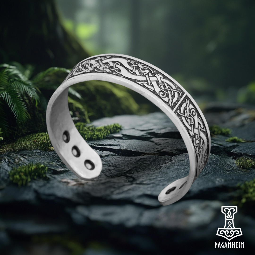 Silver-tone Norse bracelet with Urnes art style patterns.