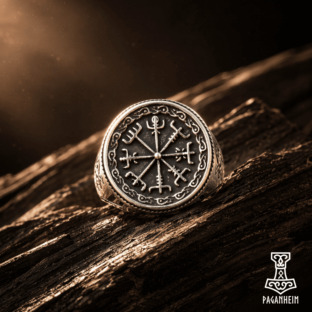 Metal ring featuring the Vegvísir symbol surrounded by Norse artistry.