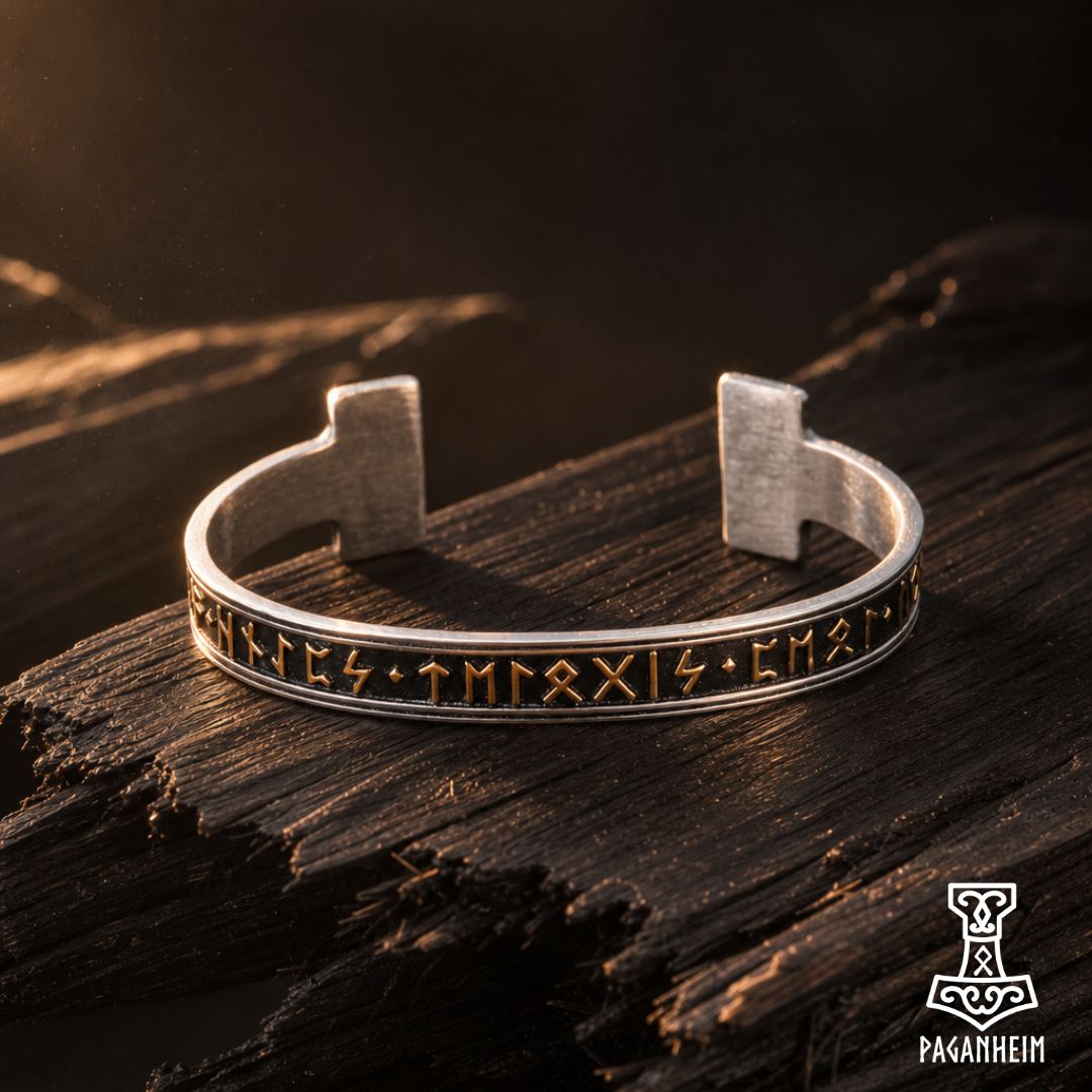 Norse‑inspired bangle featuring Elder Futhark runes and polished metal finish