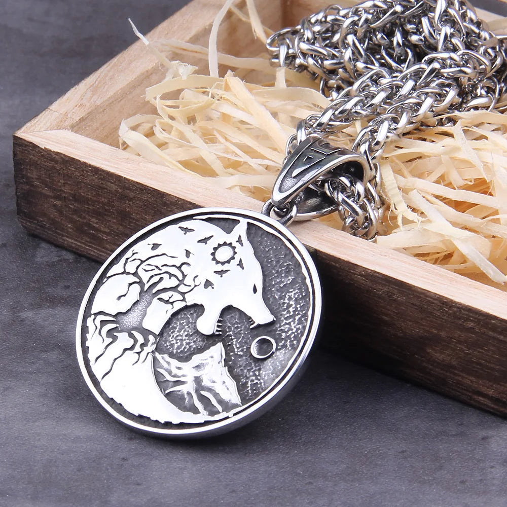 Hati pendant featuring the wolf chasing the moon, Mání, with a sun in its head.