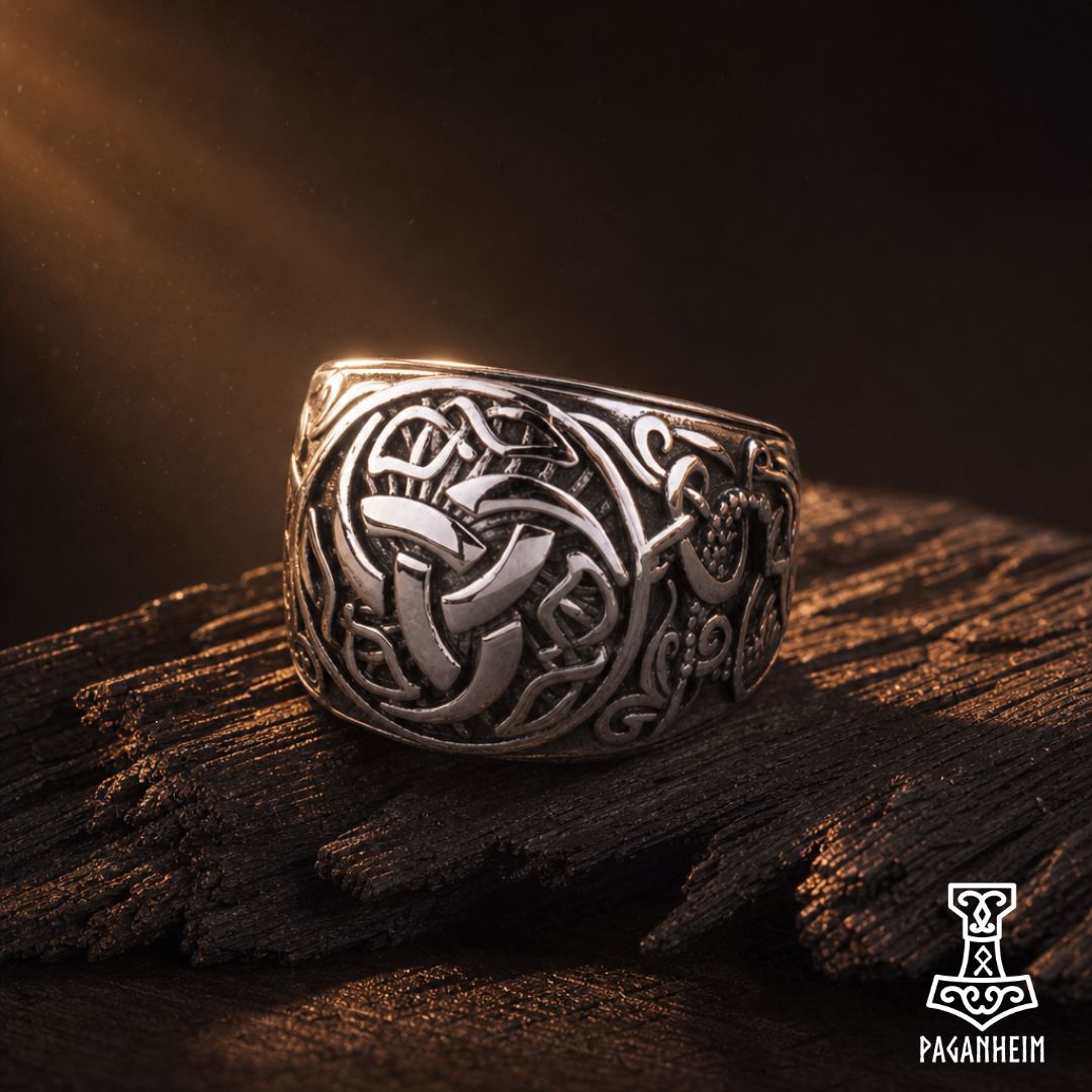 Silver ring featuring engraved Triskele symbol and Norse knotwork