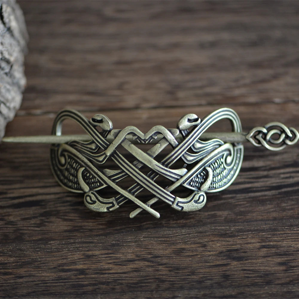 Mammen-style Viking hair pin with intricate intertwined beast designs.