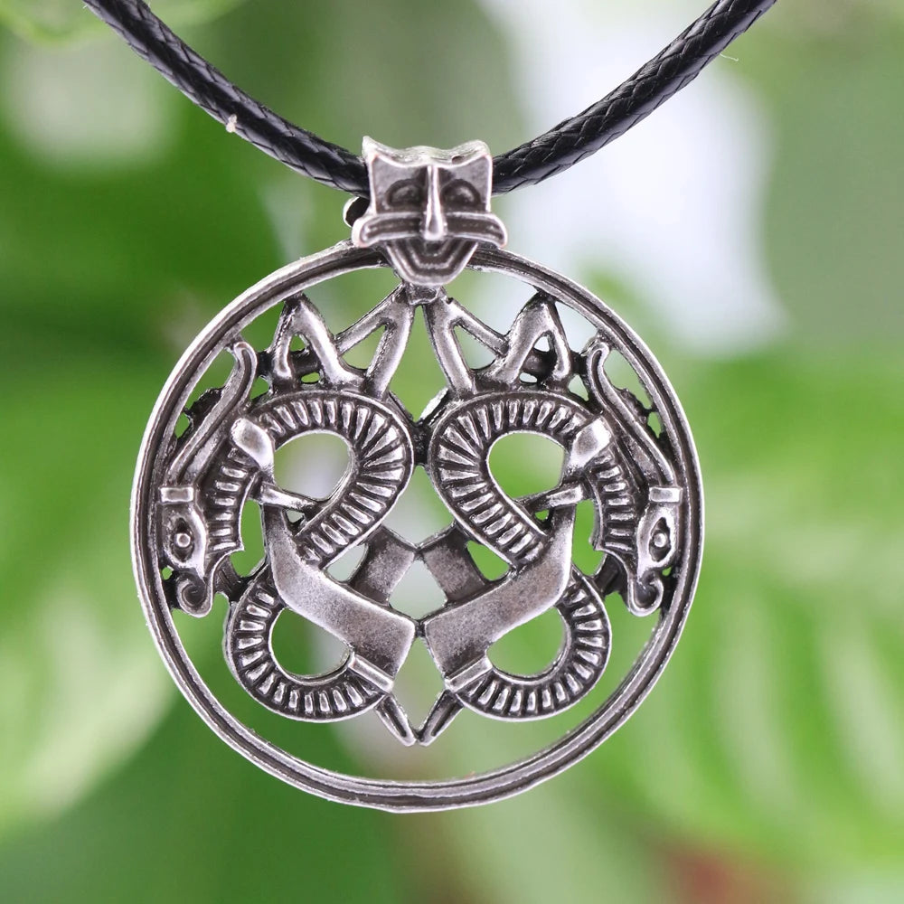 Jelling-style dragon pendant amulet inspired by Viking Age art.