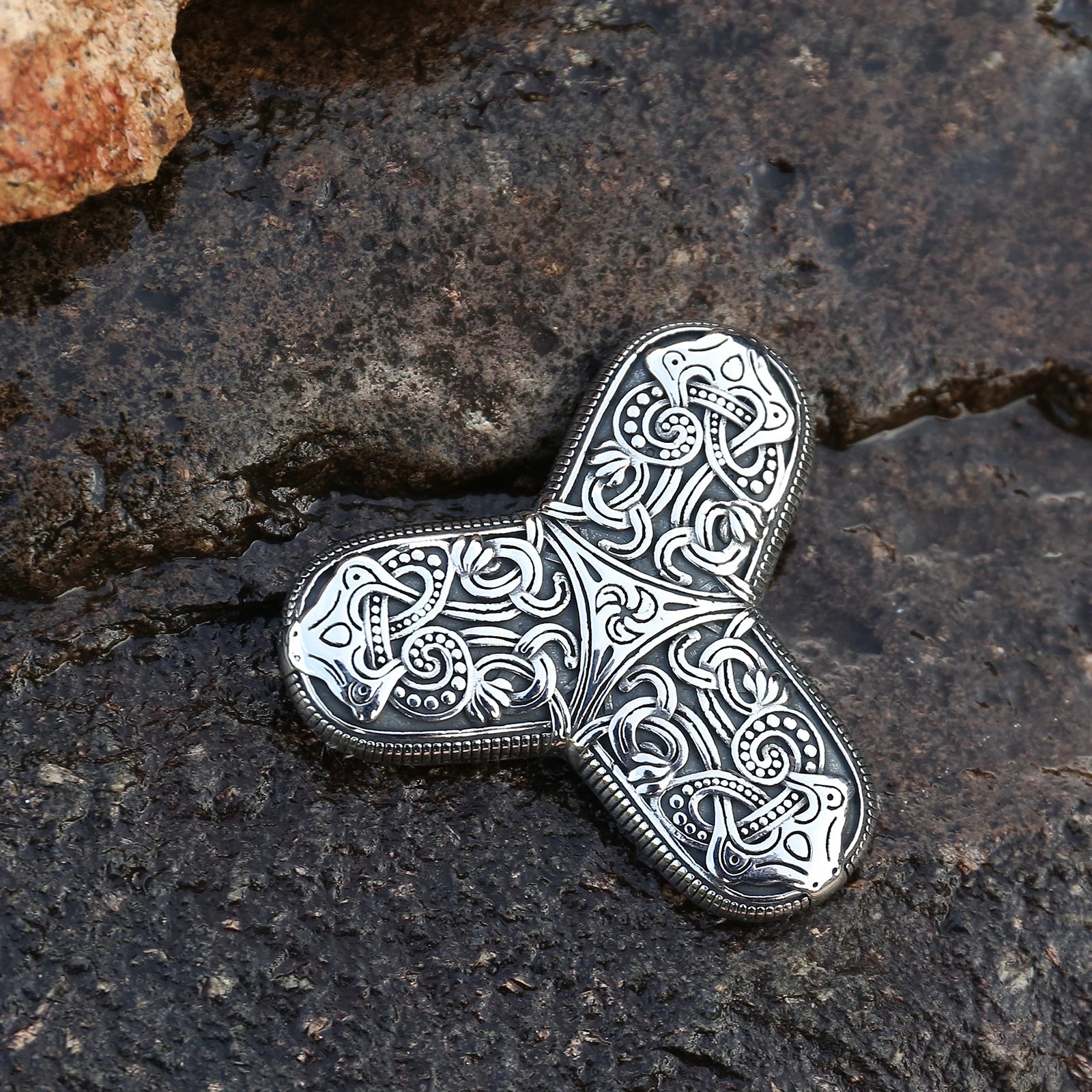 Brooch with Old Norse Jelling art style engravings.